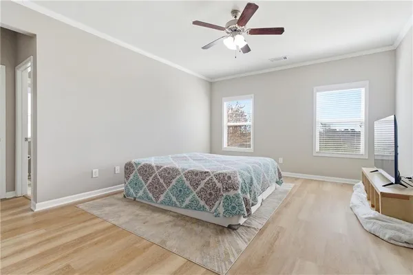 a bedroom with a large bed and a window
