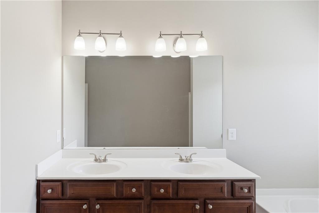 4479 Clubside Drive Gainesville, GA 30504 - Photo 23 of 47 a bathroom with a sink and a mirror