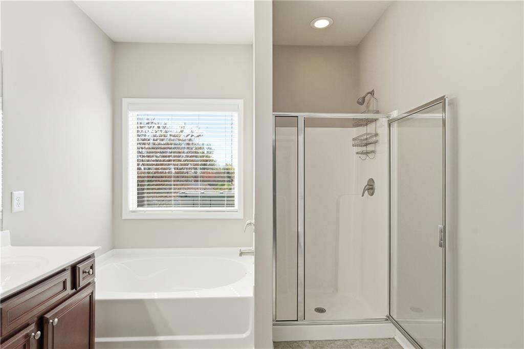 4479 Clubside Drive Gainesville, GA 30504 - Photo 24 of 47 a bathroom with a bathtub and a shower