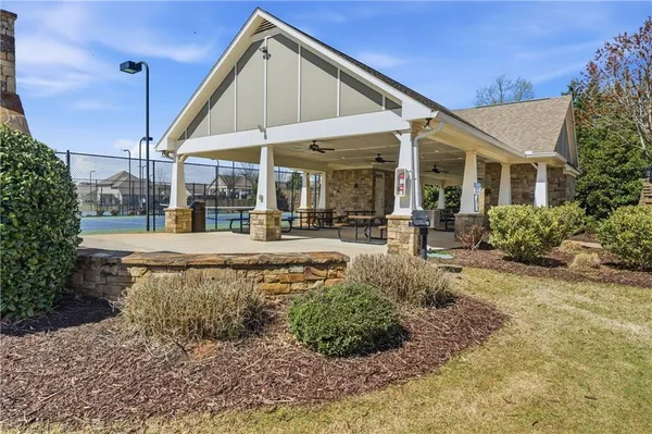 a view of a house with backyard and porch