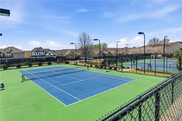 a view of an outdoor space and tennis court