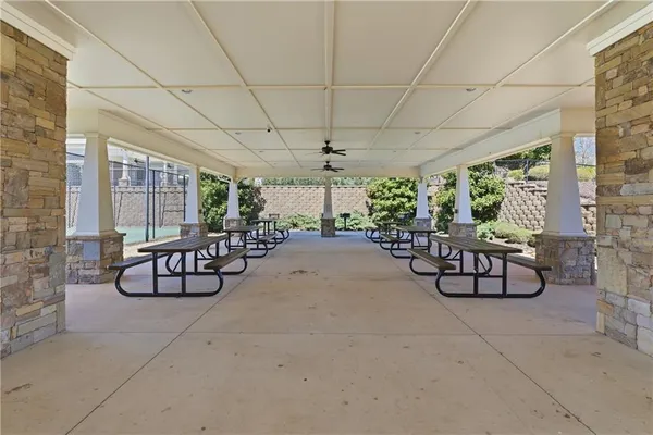 a view of a livingroom with furniture and a potted plant