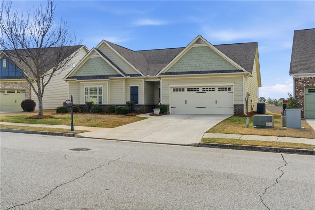 4479 Clubside Drive Gainesville, GA 30504 - Photo 5 of 47 a view of a house with a small yard and plants