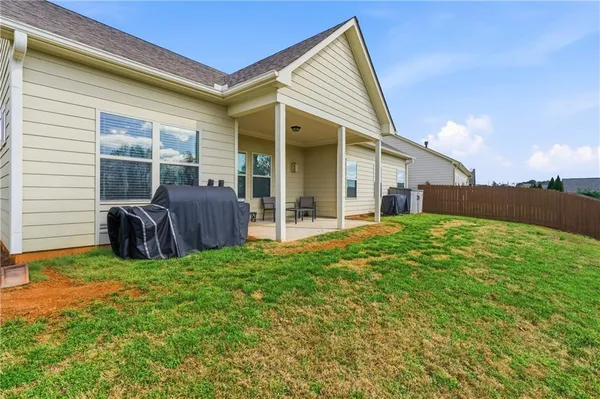 a view of backyard with a garden and deck