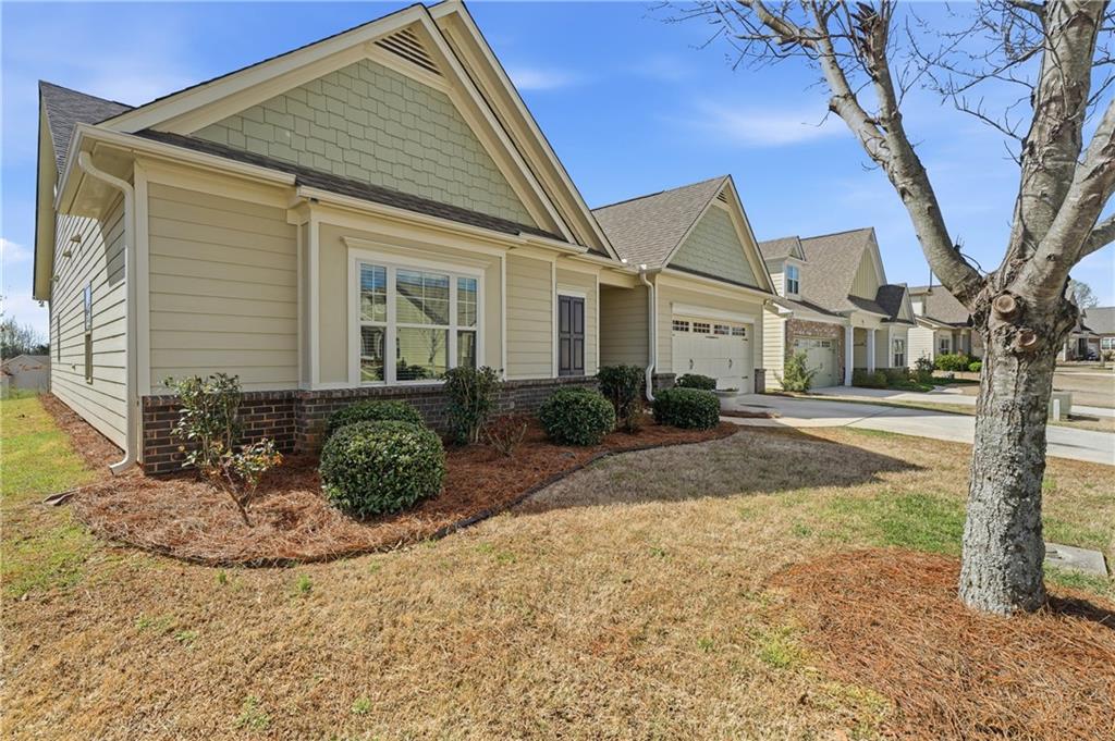 4479 Clubside Drive Gainesville, GA 30504 - Photo 10 of 47 a front view of a house with garden