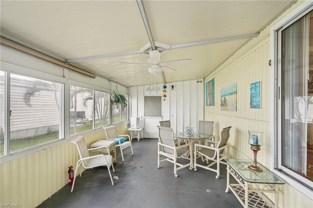 104 Willow Lane, Unit 30 Naples, FL 34114 - Photo 27 of 30 Sunroom featuring ceiling fan and outdoor dining space