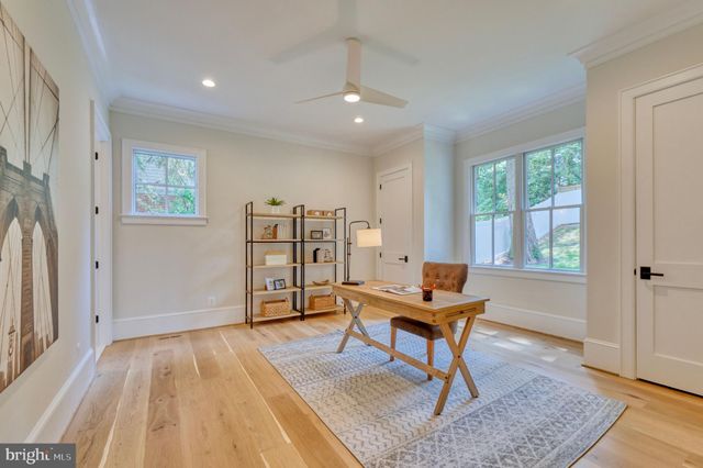 a spacious bedroom with a bed and furniture
