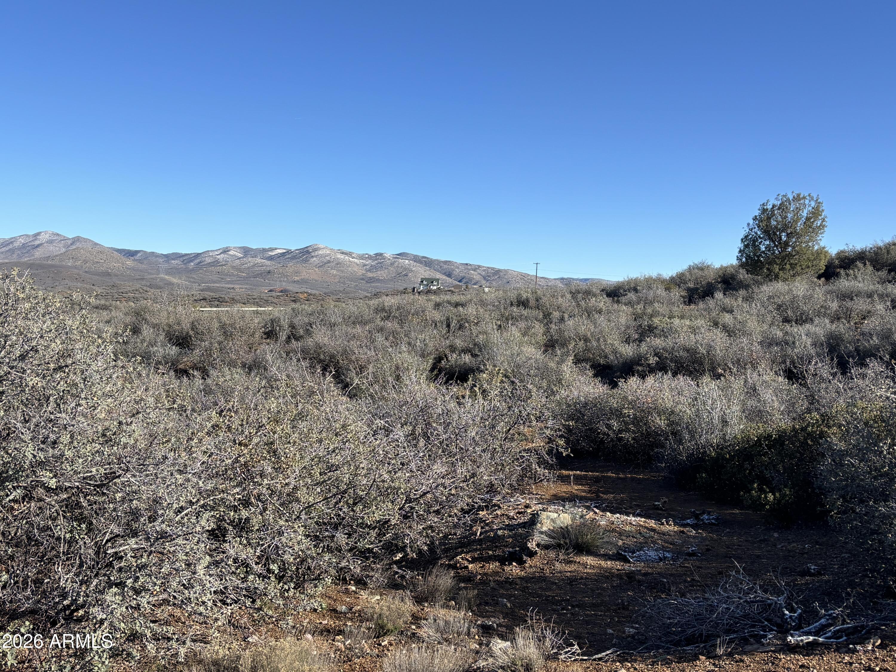 64 South Dewey Overlook Way Dewey, AZ 86327 - Photo 16 of 19 a view of a dry yard with mountains in the background