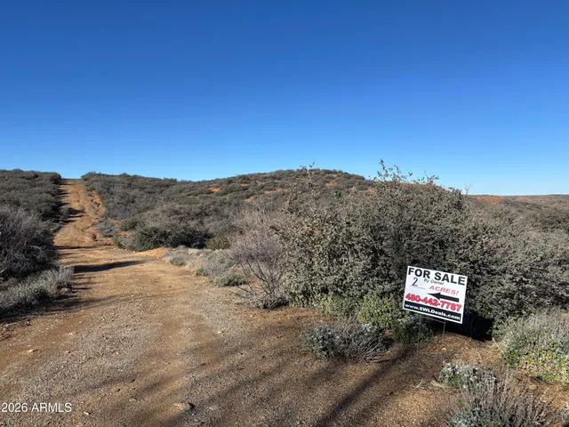 a view of a road with mountains in the background