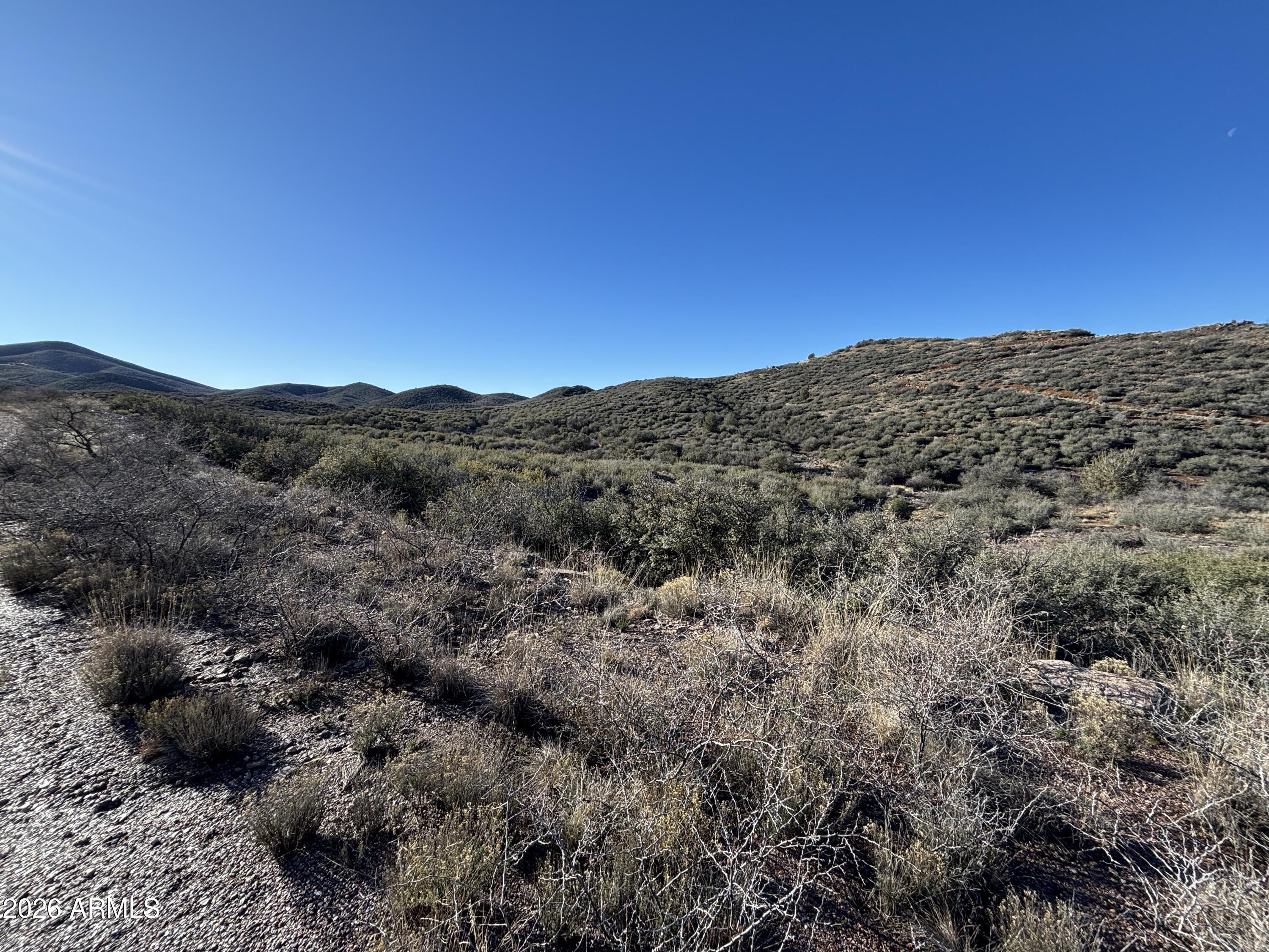 64 South Dewey Overlook Way Dewey, AZ 86327 - Photo 8 of 19 a view of a mountain in the distance in a field