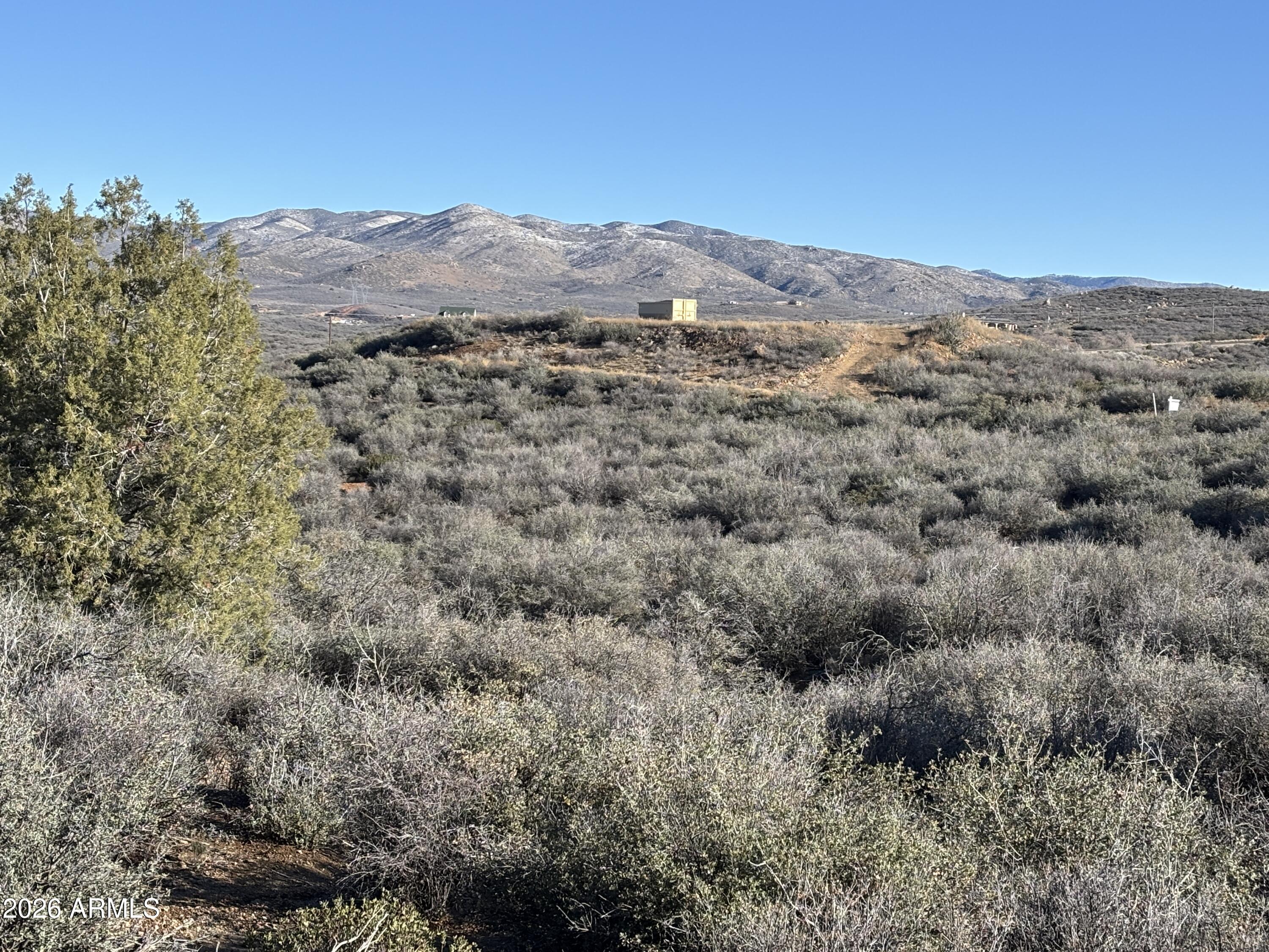 64 South Dewey Overlook Way Dewey, AZ 86327 - Photo 10 of 19 a view of a dry field with mountains in the background