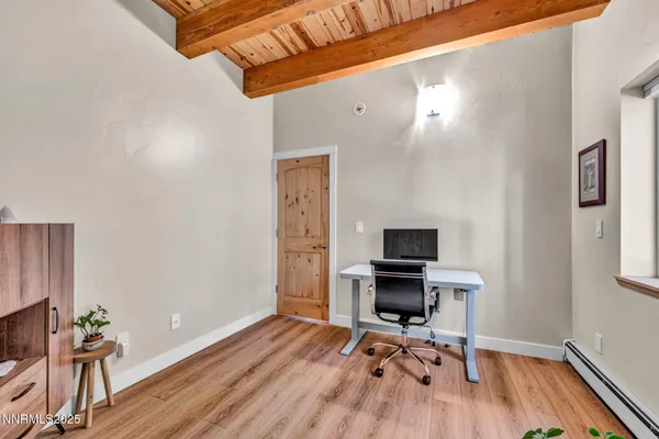 a view of a room with wooden floor and outdoor space