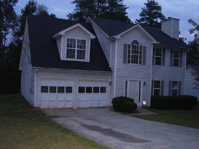 2403 Charleston Terrace Decatur, GA 30034 - Photo 1 of 1 a view of a house with a yard plants and large tree