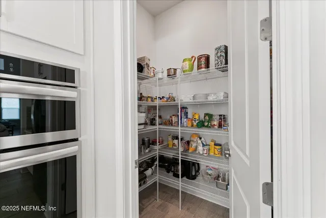 a shelf with books and knick knacks on it