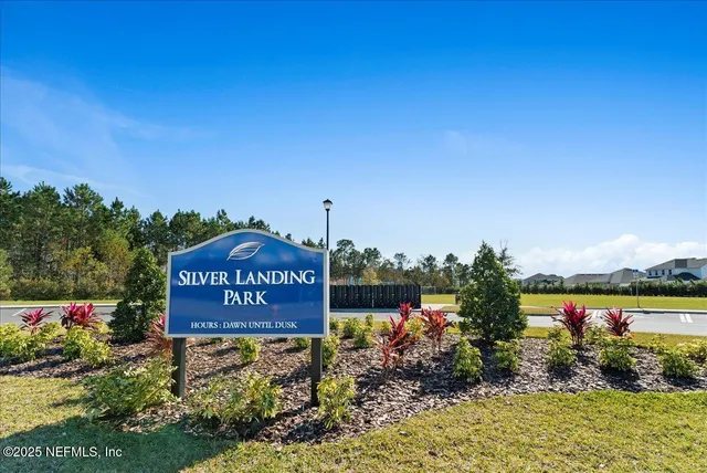 a view of a swimming pool with a patio and a yard