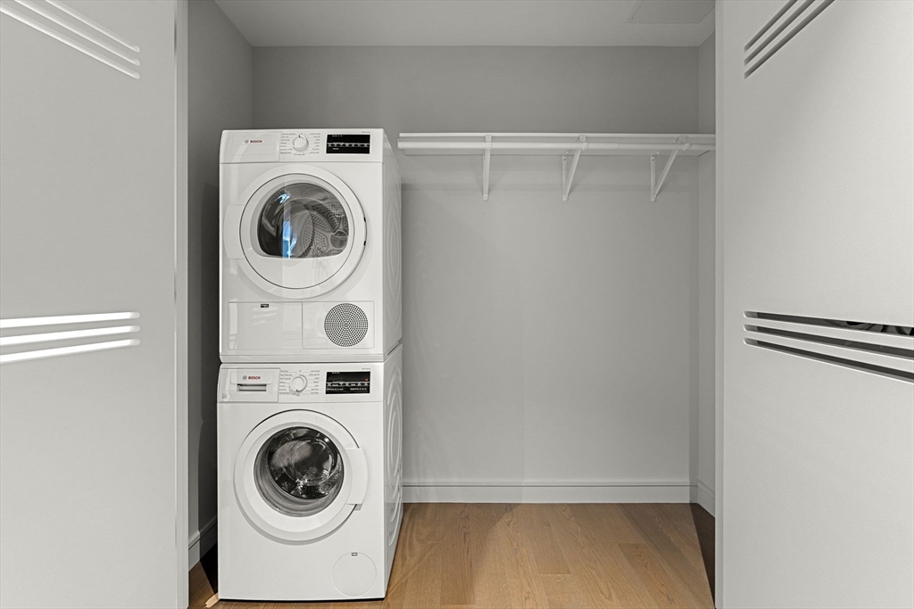 55 Lagrange Street, Unit 1703 Boston, MA 02111 - Photo 16 of 33 a utility room with dryer and washer