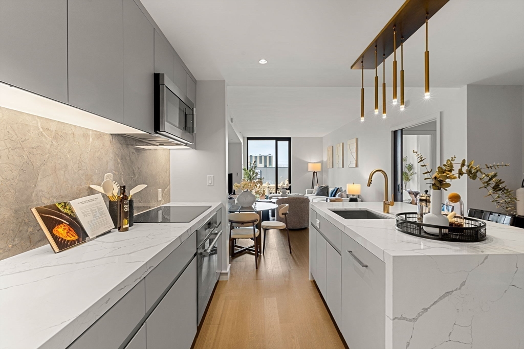 55 Lagrange Street, Unit 1703 Boston, MA 02111 - Photo 7 of 33 a very nice looking living room with a couch