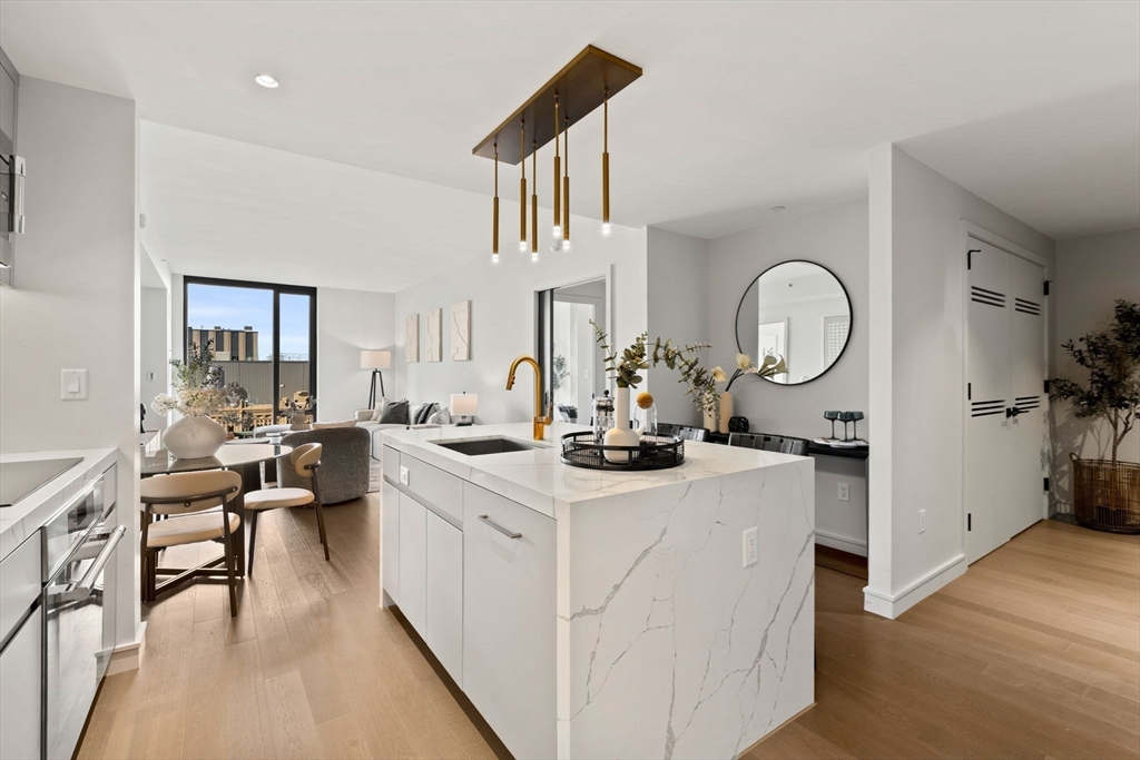 55 Lagrange Street, Unit 1703 Boston, MA 02111 - Photo 8 of 33 a view of living room and kitchen with furniture