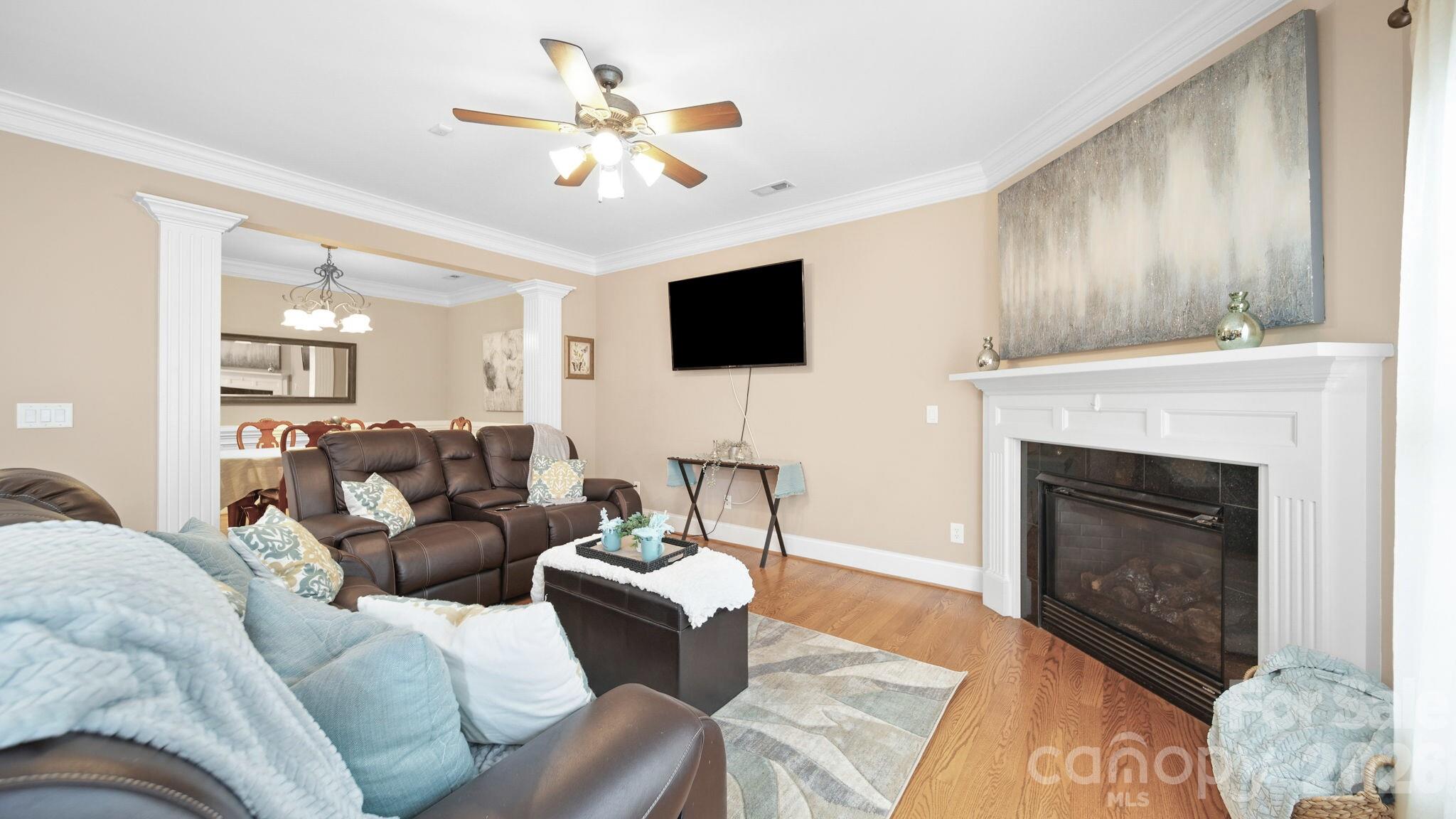 804 Talking Stick Lane Fort Mill, SC 29708 - Photo 11 of 34 a living room with furniture a fireplace and a flat screen tv