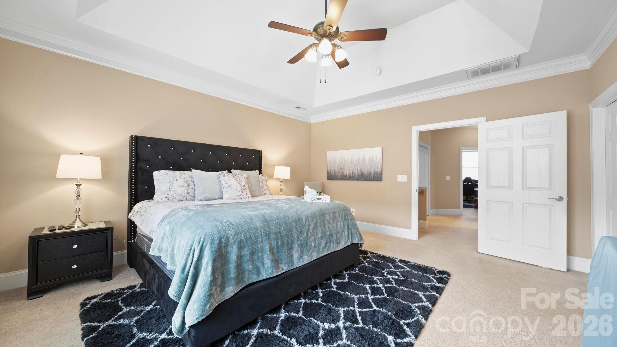 804 Talking Stick Lane Fort Mill, SC 29708 - Photo 19 of 34 a bedroom with a bed and a lamp