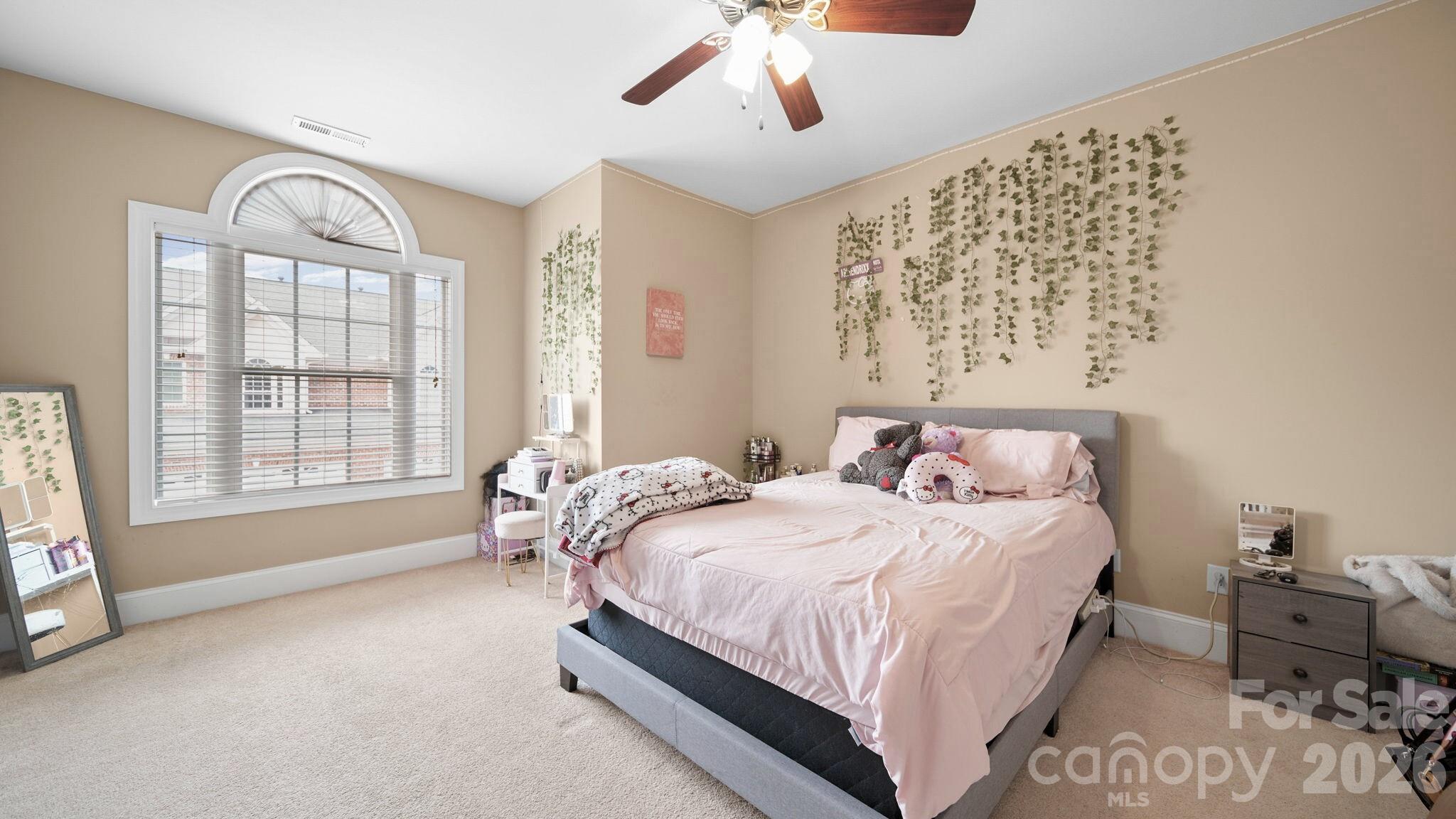 804 Talking Stick Lane Fort Mill, SC 29708 - Photo 21 of 34 a bedroom with a bed couch and a window