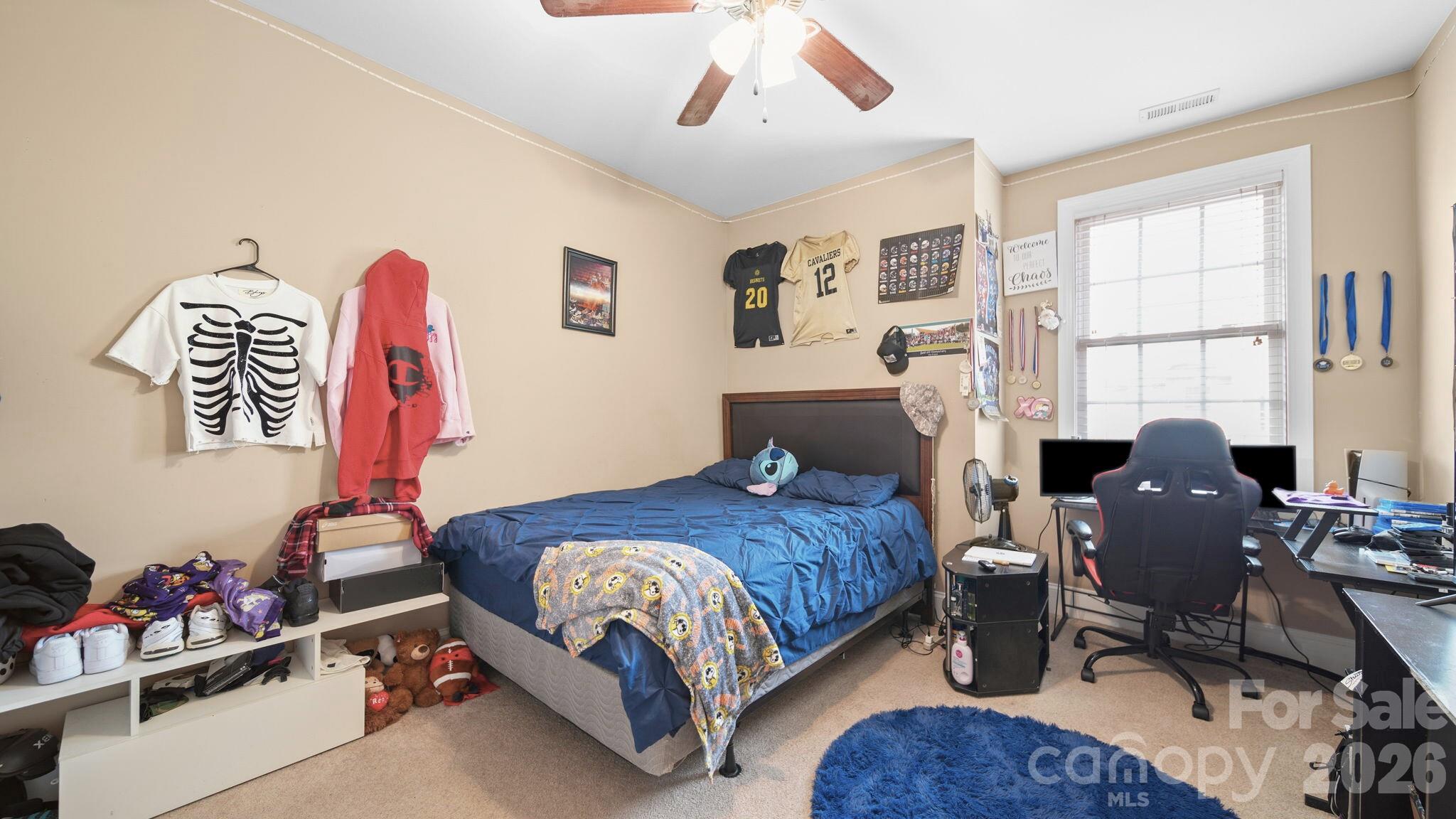 804 Talking Stick Lane Fort Mill, SC 29708 - Photo 24 of 34 a bedroom with a bed window and desk