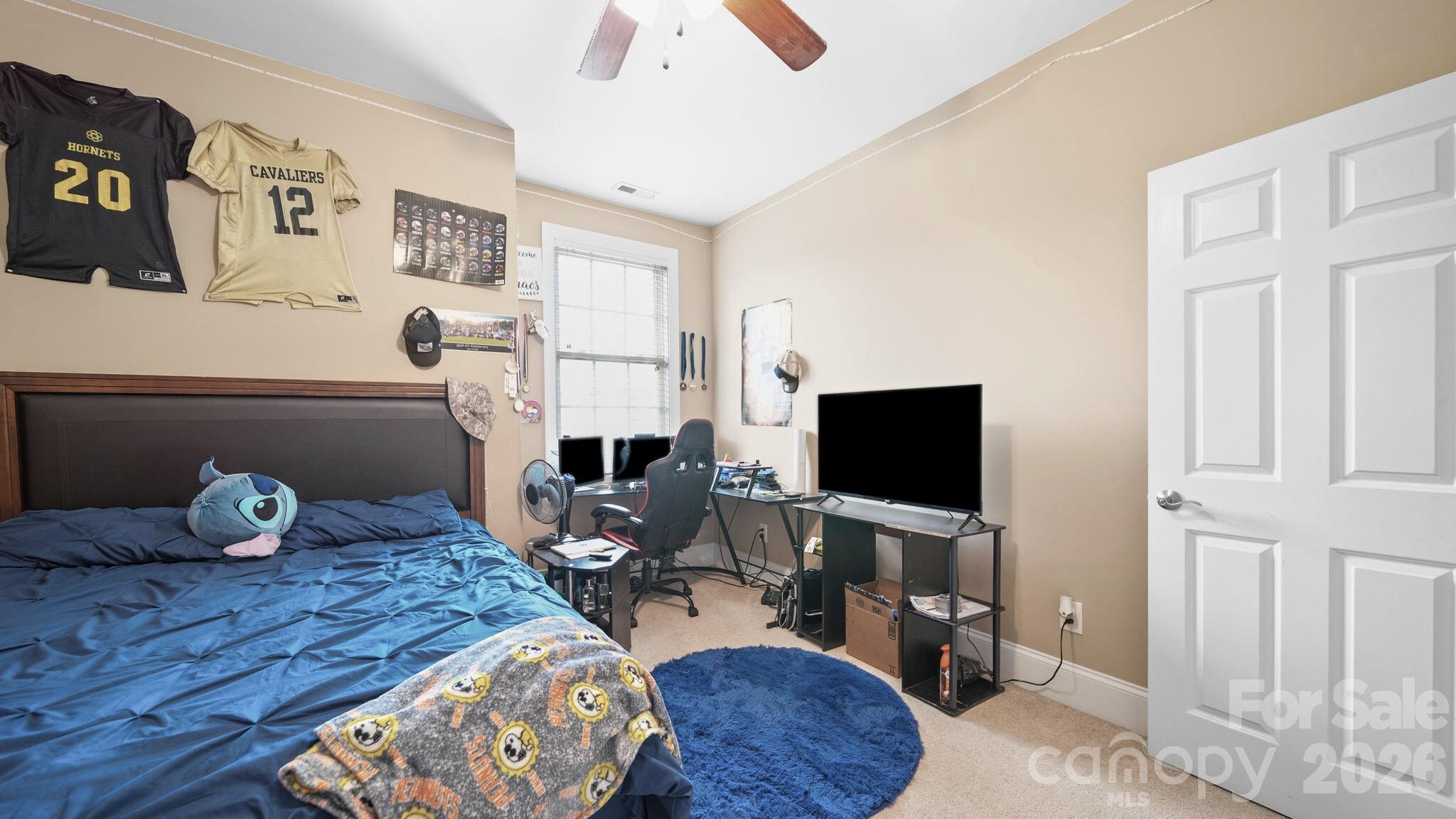 804 Talking Stick Lane Fort Mill, SC 29708 - Photo 25 of 34 a living room with furniture and a flat screen tv