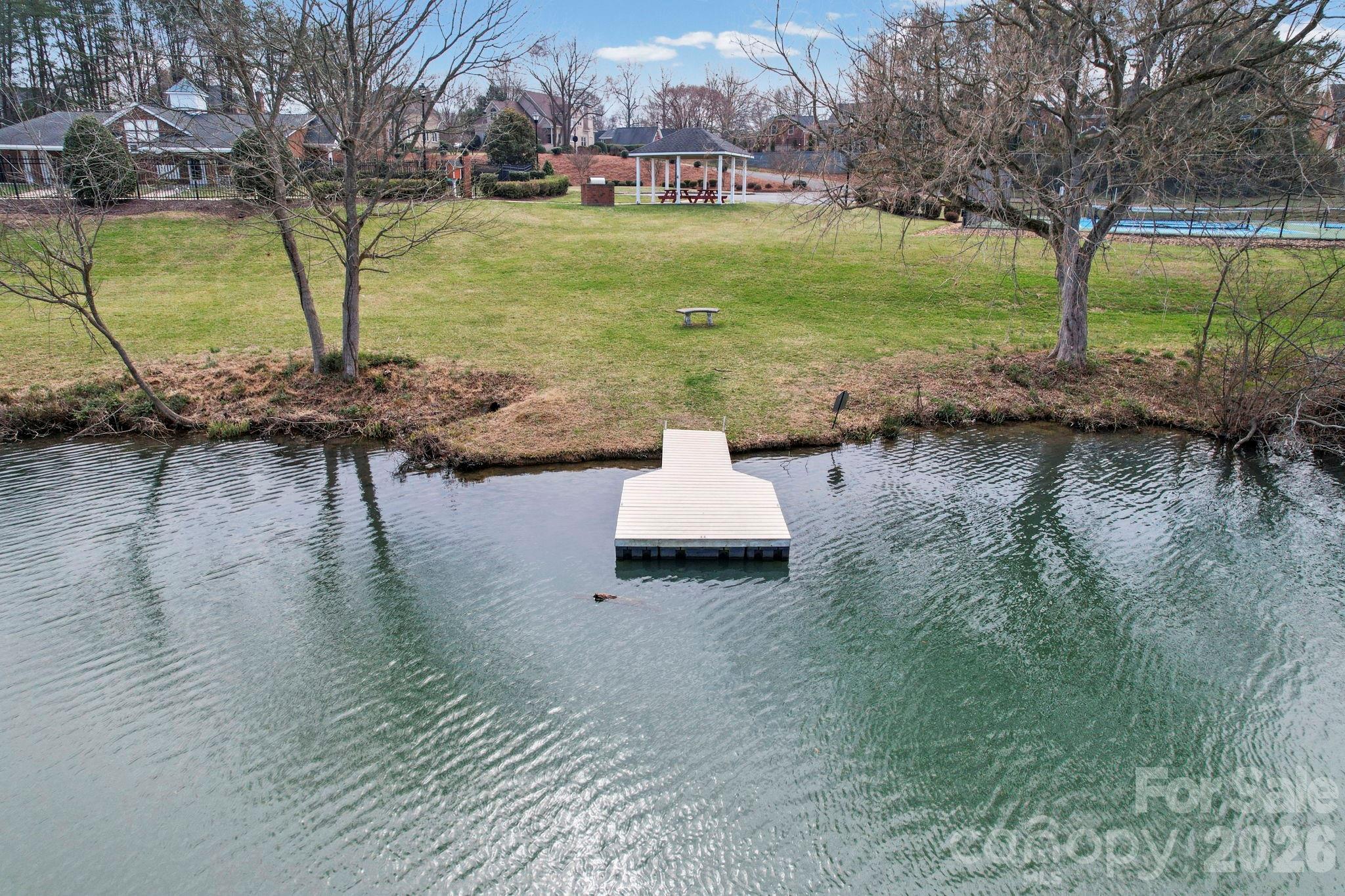 804 Talking Stick Lane Fort Mill, SC 29708 - Photo 29 of 34 a lake view with a bench and trees