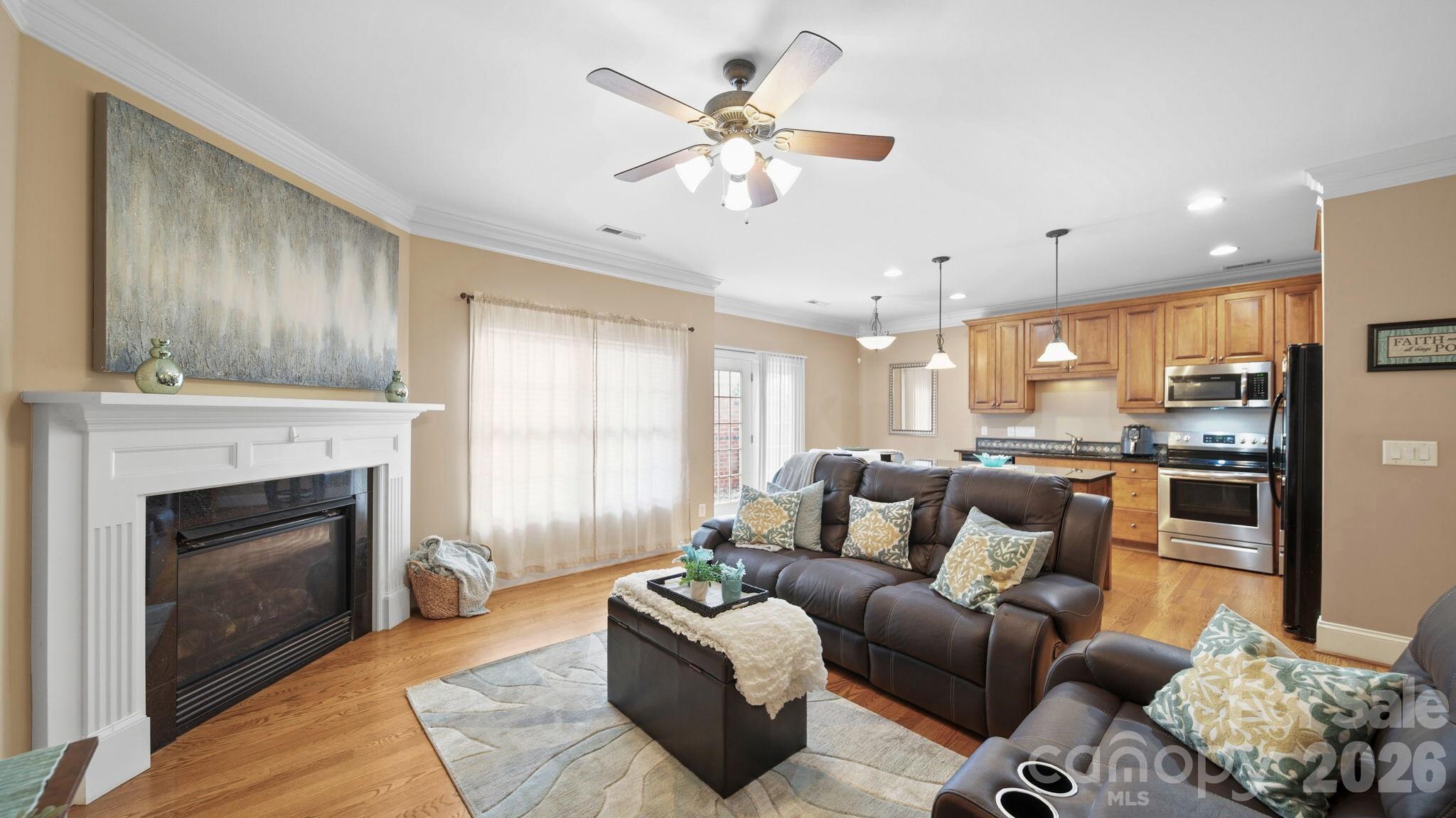 804 Talking Stick Lane Fort Mill, SC 29708 - Photo 3 of 34 a living room with furniture fireplace and kitchen view