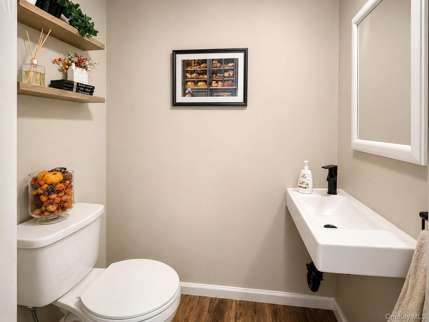 9 Penn Commons Yaphank, NY 11980 - Photo 11 of 34 a white toilet sitting next to a bathroom sink