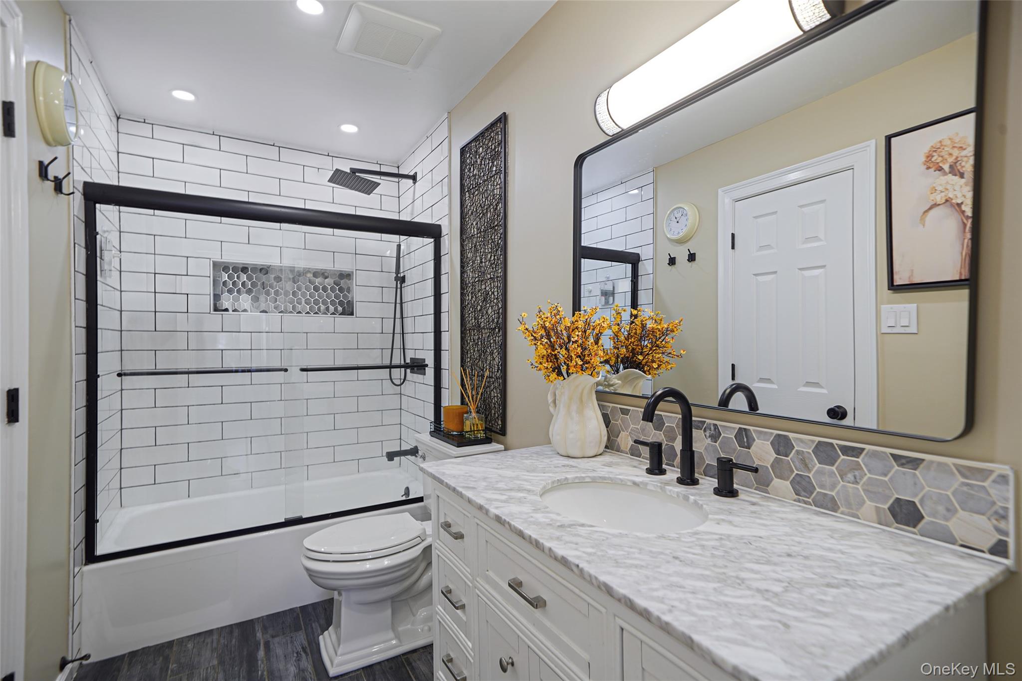 9 Penn Commons Yaphank, NY 11980 - Photo 19 of 34 a bathroom with a granite countertop sink toilet and shower