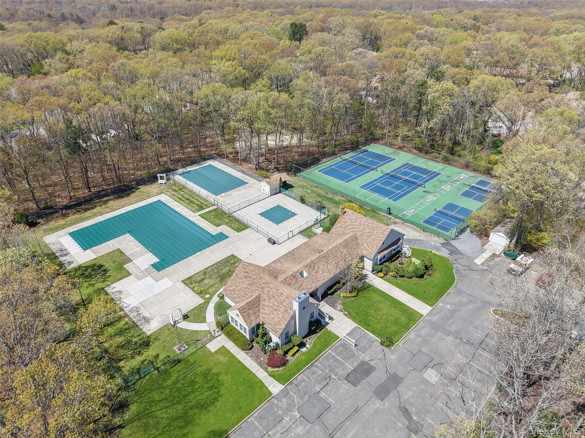 9 Penn Commons Yaphank, NY 11980 - Photo 31 of 34 an aerial view of a house with a big yard