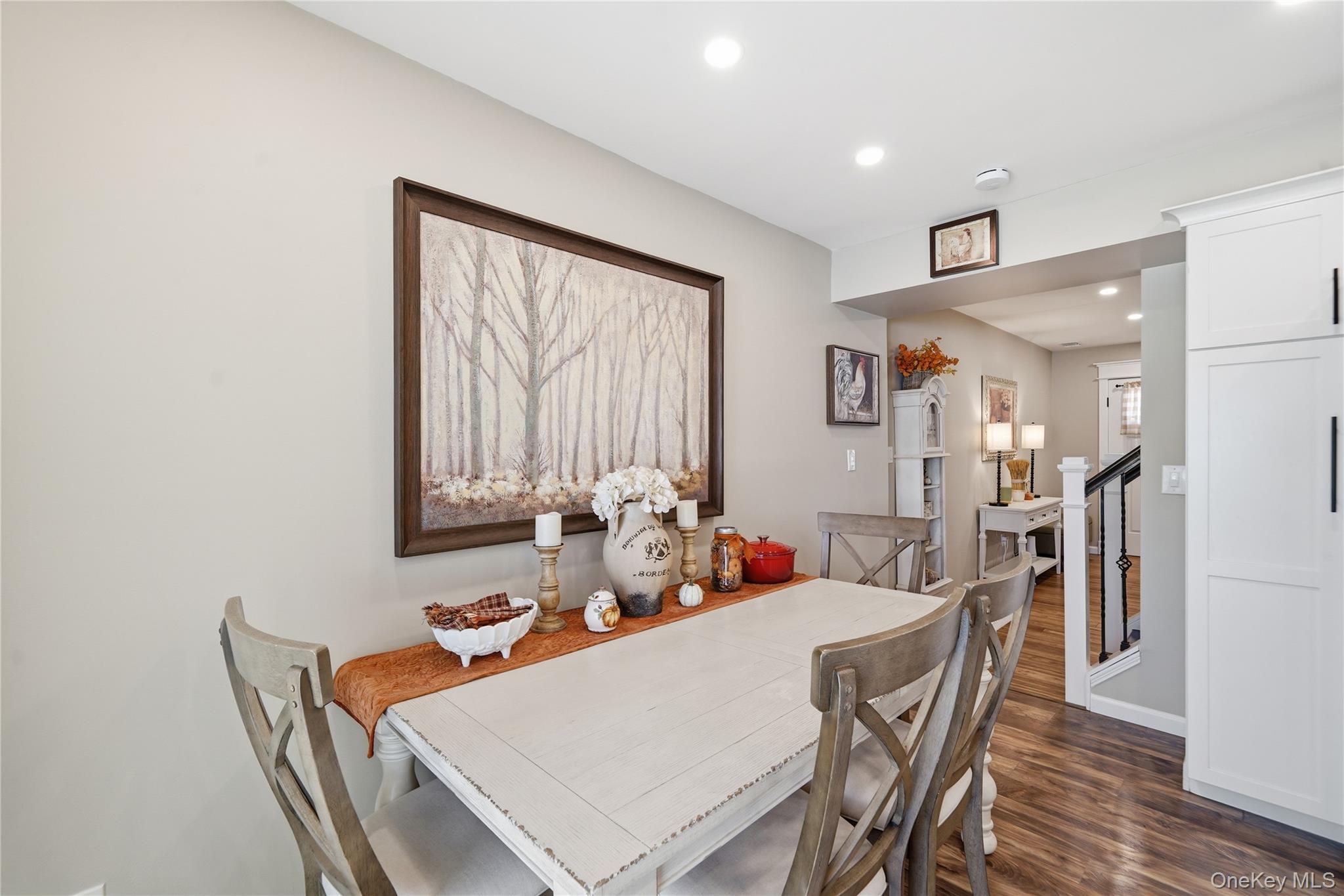 9 Penn Commons Yaphank, NY 11980 - Photo 5 of 34 a view of a dining room with furniture and wooden floor