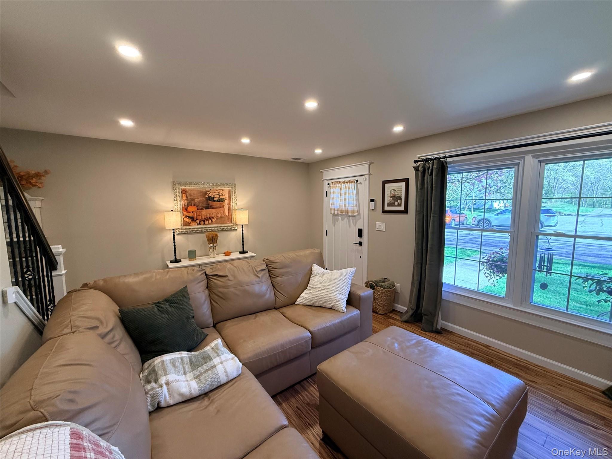 9 Penn Commons Yaphank, NY 11980 - Photo 10 of 34 a living room with furniture and a large window