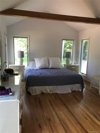 a bedroom with a bed and window