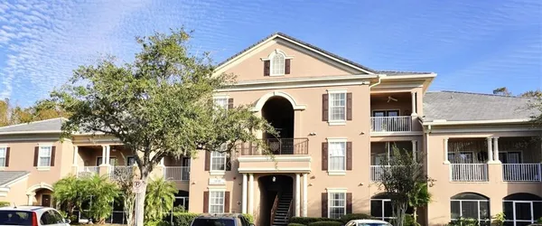 a front view of a house with a lot of windows