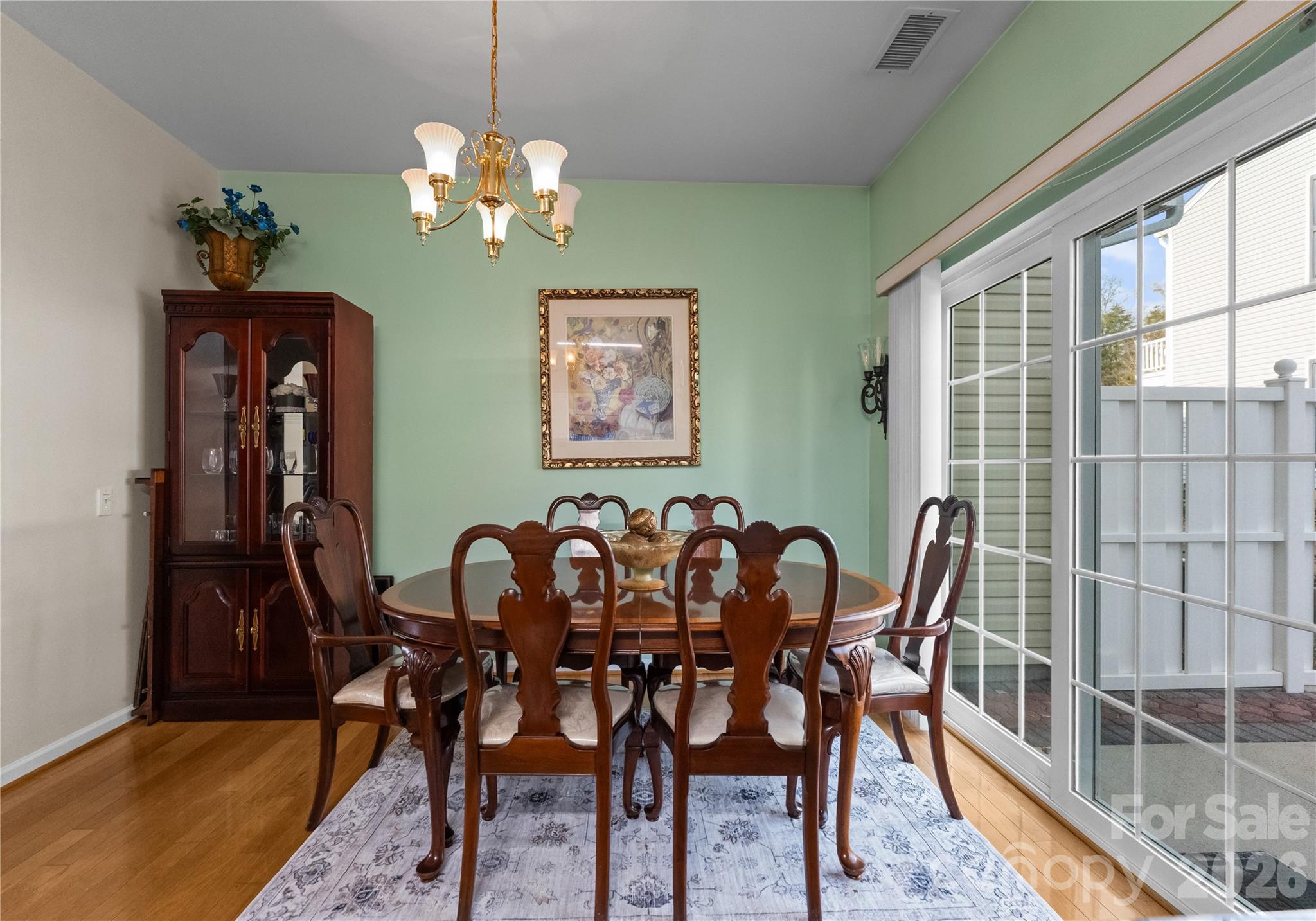 6776 Rothchild Drive Charlotte, NC 28270 - Photo 12 of 40 a view of a dining room with furniture and chandelier
