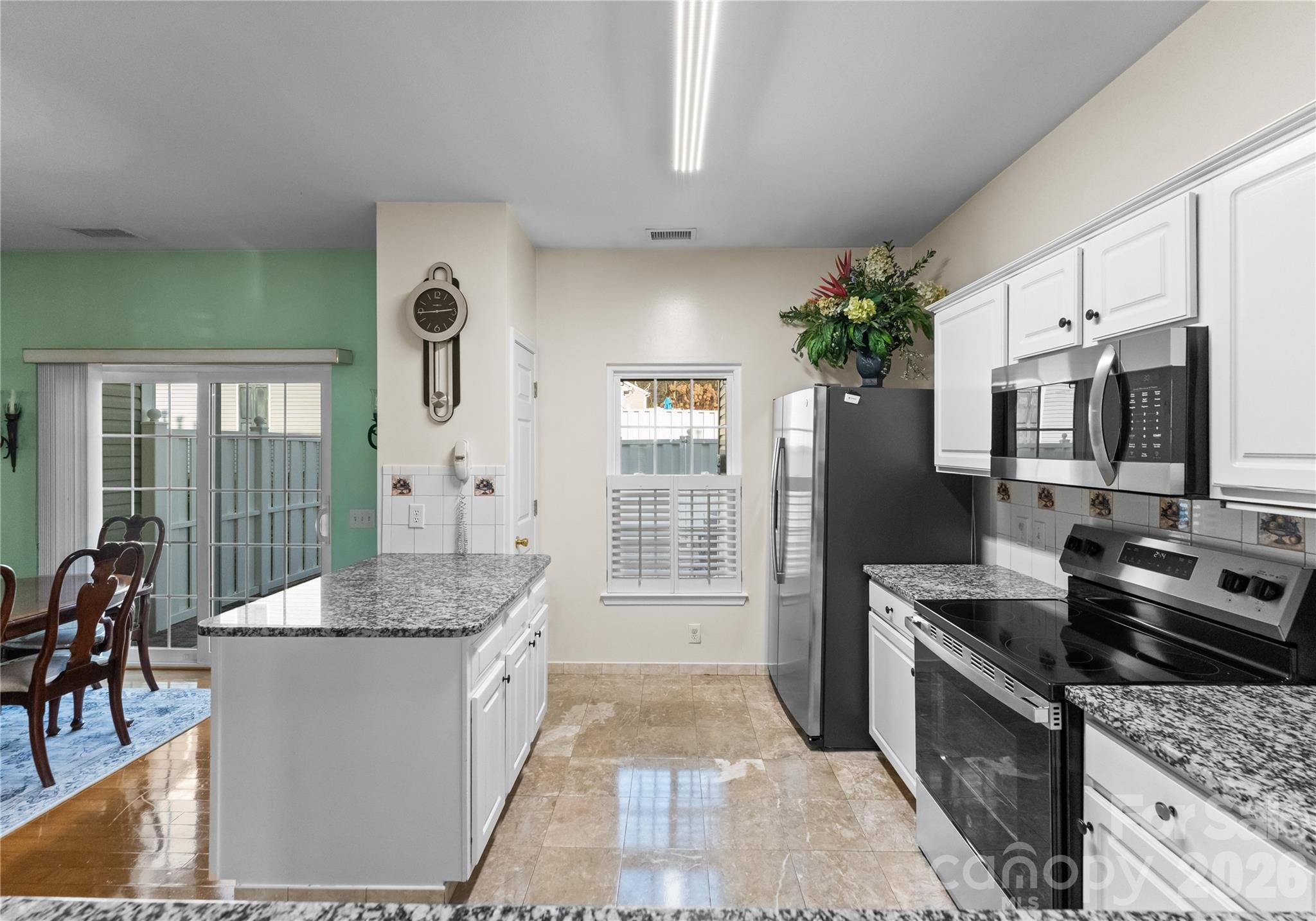 6776 Rothchild Drive Charlotte, NC 28270 - Photo 13 of 40 a kitchen with stainless steel appliances granite countertop a stove a sink and a refrigerator