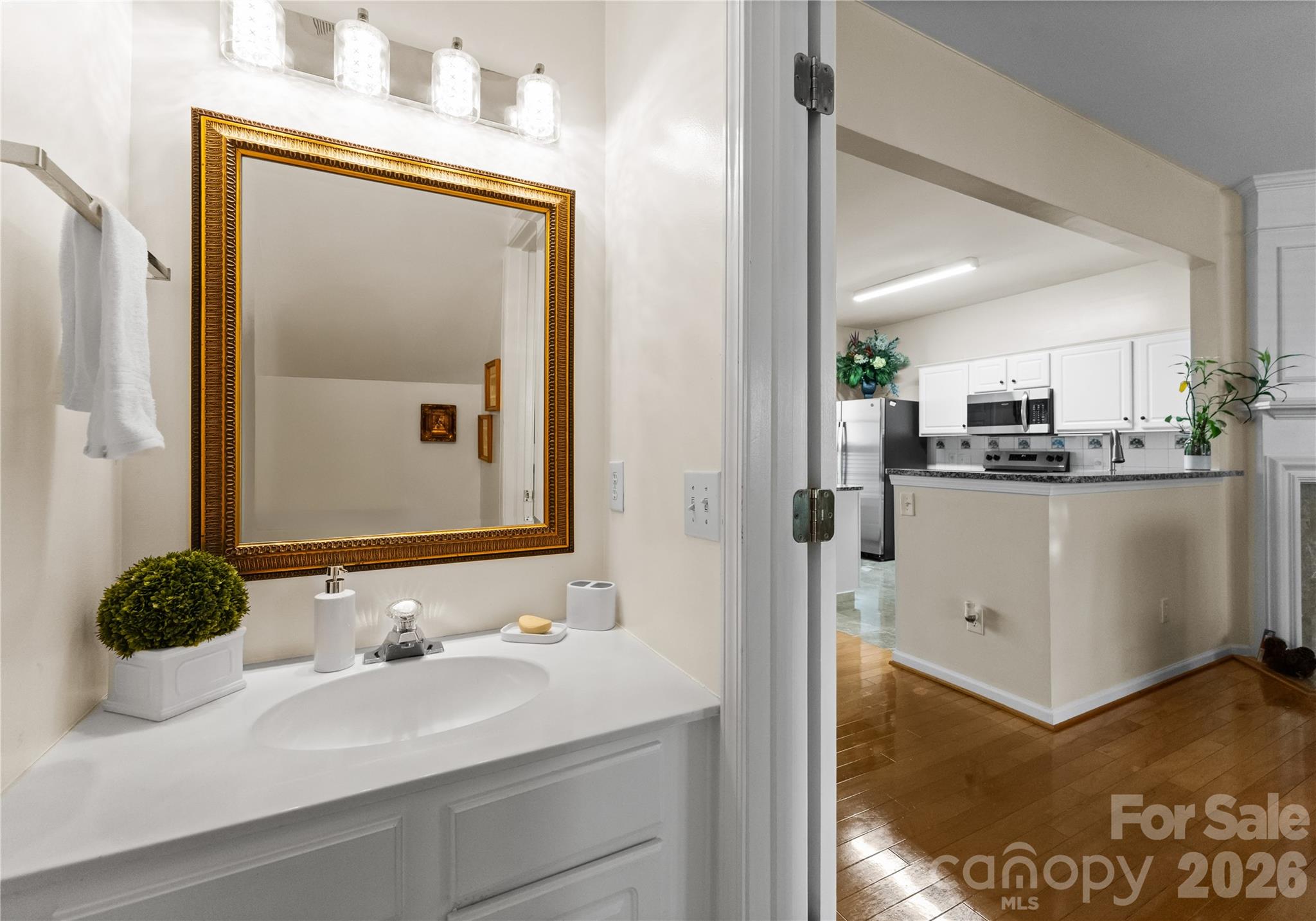 6776 Rothchild Drive Charlotte, NC 28270 - Photo 17 of 40 a bathroom with a sink a mirror and a shower