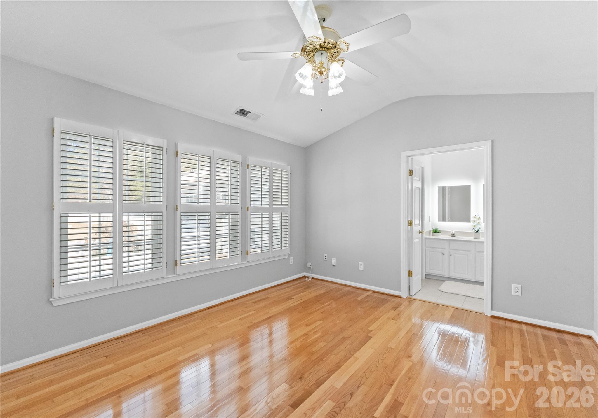 6776 Rothchild Drive Charlotte, NC 28270 - Photo 19 of 40 a view of an empty room with a window and a kitchen view