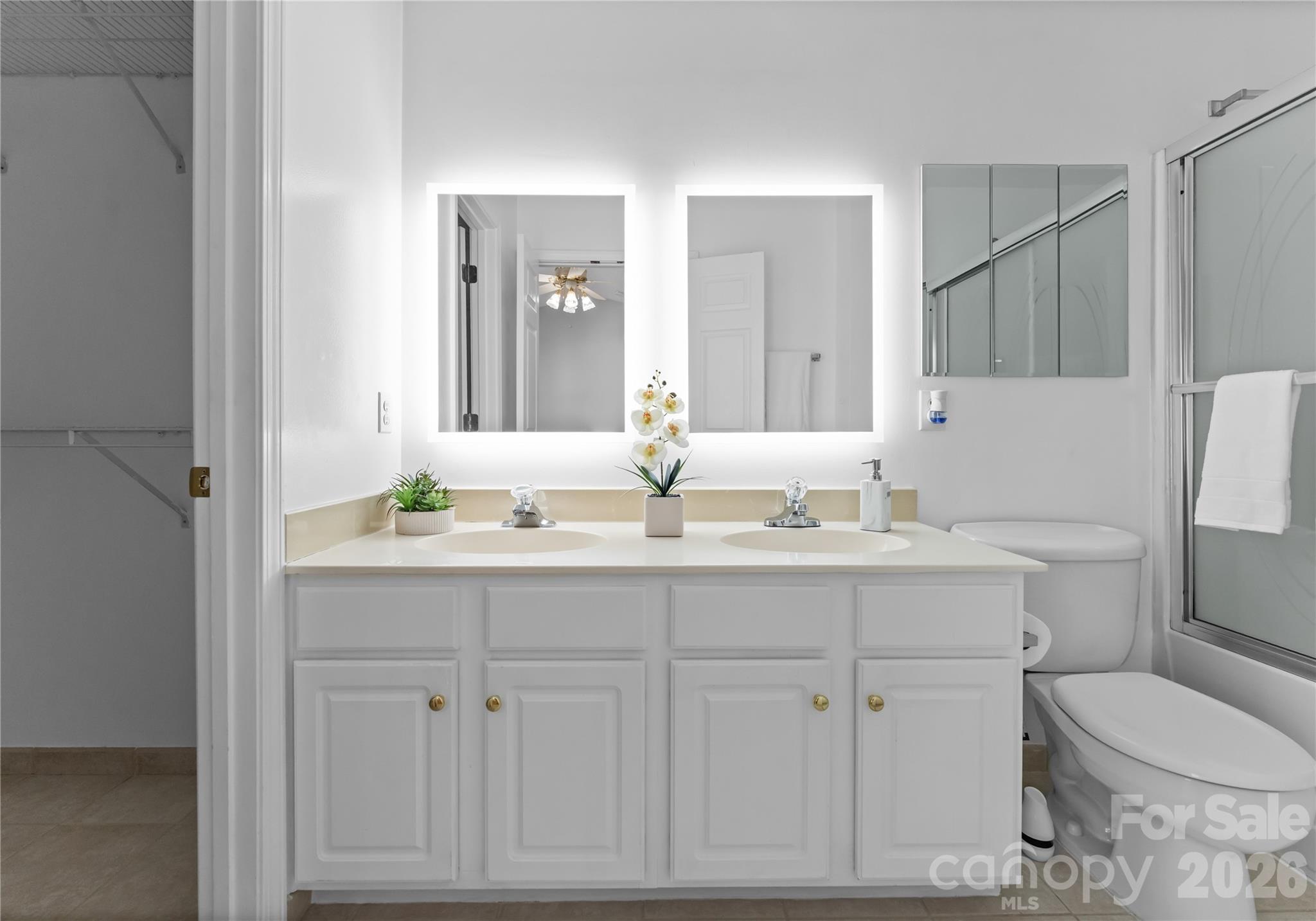 6776 Rothchild Drive Charlotte, NC 28270 - Photo 20 of 40 a bathroom with a sink toilet and mirror