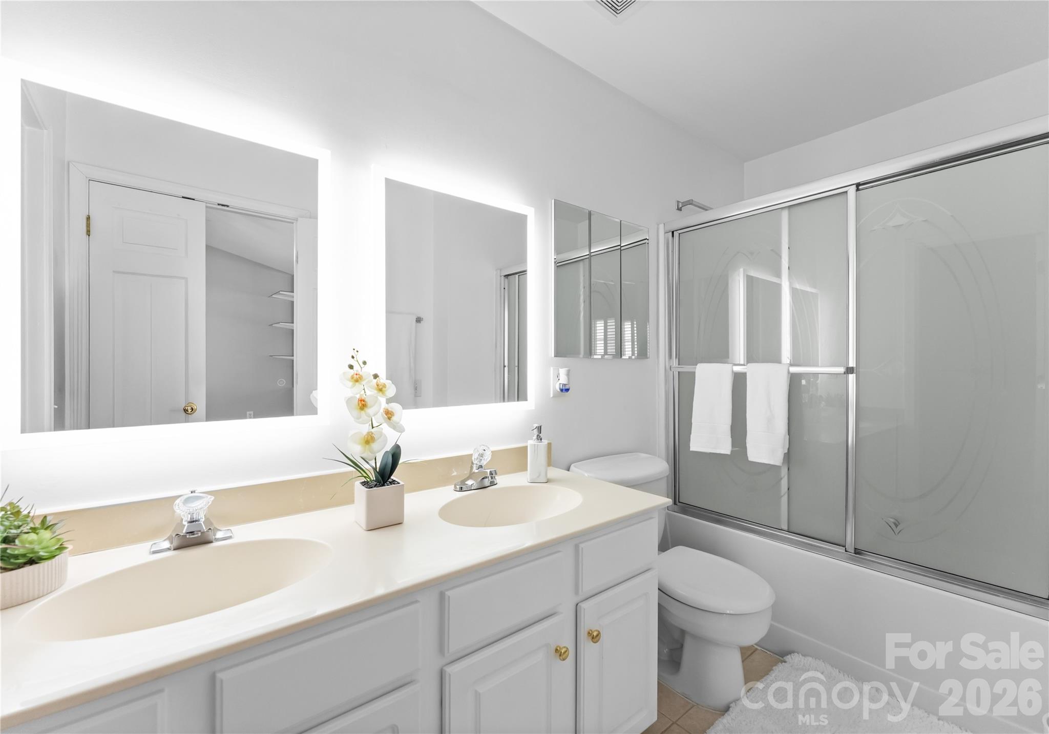 6776 Rothchild Drive Charlotte, NC 28270 - Photo 21 of 40 a bathroom with a sink a toilet and shower