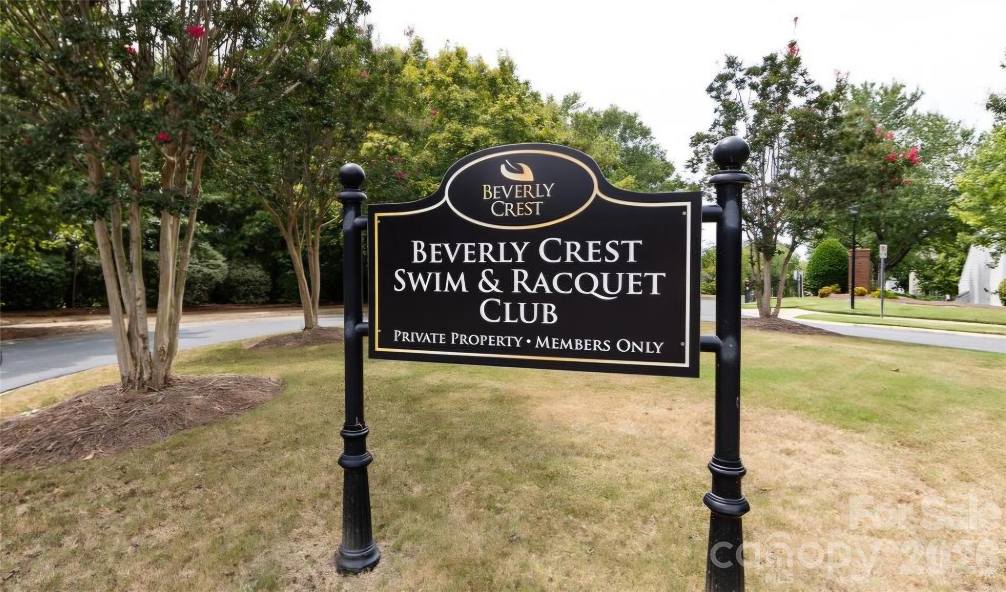 6776 Rothchild Drive Charlotte, NC 28270 - Photo 33 of 40 a view of a street sign under a large tree