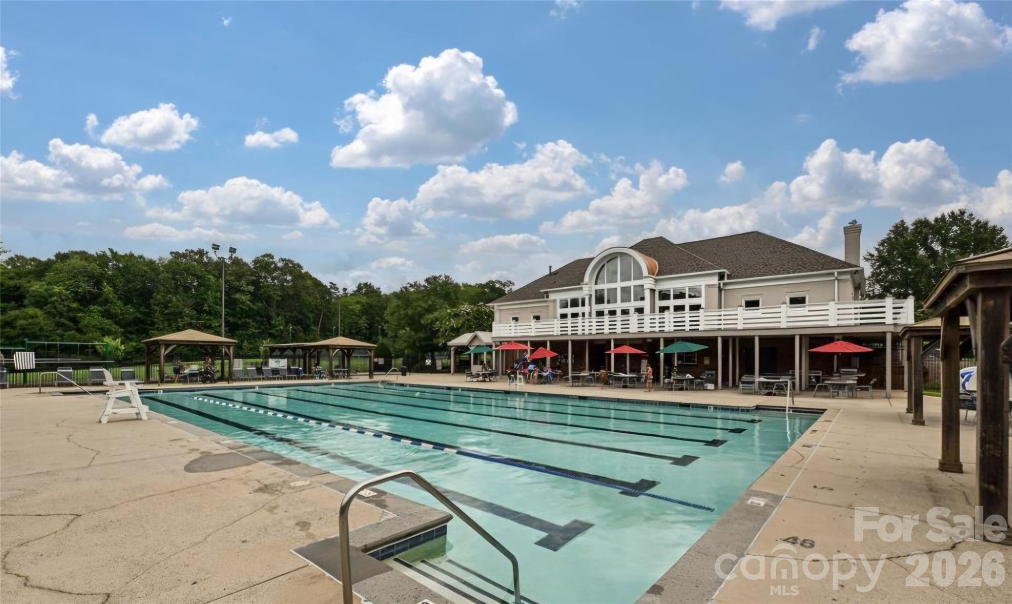 6776 Rothchild Drive Charlotte, NC 28270 - Photo 35 of 40 a view of a white house with a yard
