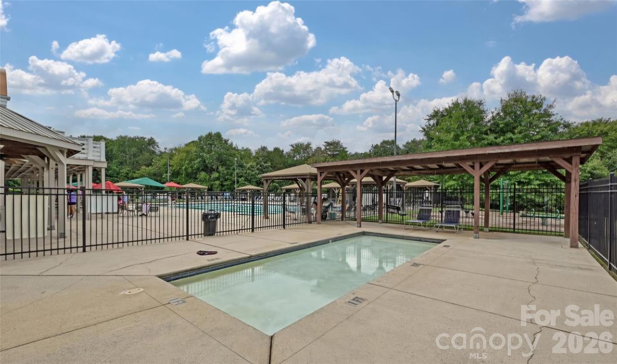 6776 Rothchild Drive Charlotte, NC 28270 - Photo 36 of 40 a view of a swimming pool with a patio