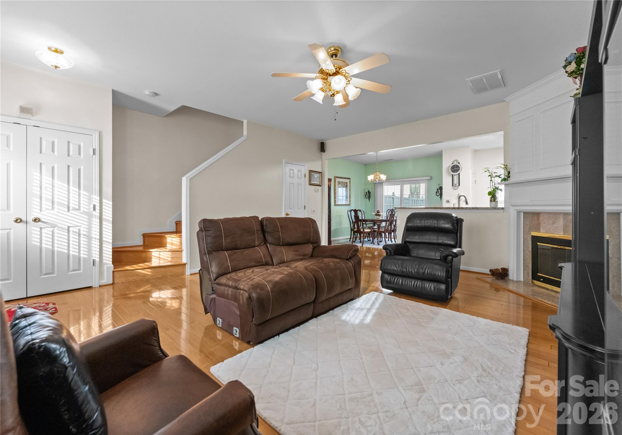 6776 Rothchild Drive Charlotte, NC 28270 - Photo 8 of 40 a living room with furniture and a chandelier