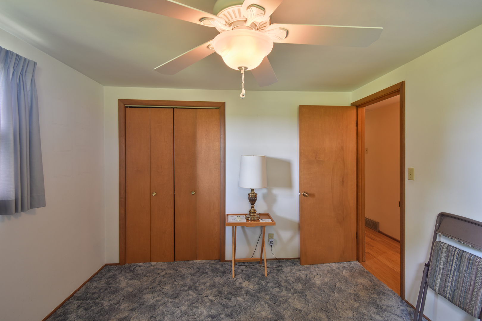 1542 East 18th Road Streator, IL 61364 - Photo 19 of 47 a view of a room with a hanging light and hardwood floor
