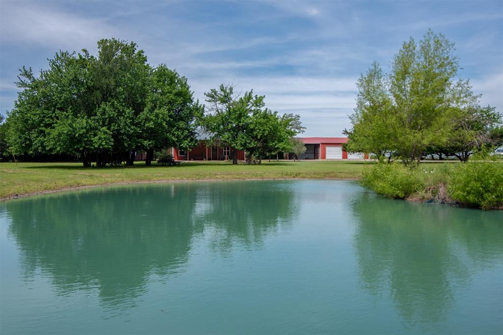8665 Cr-669 Blue Ridge Blue Ridge, TX 75424 - Photo 7 of 40 a view of a lake with a building in the background