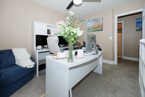 a view of kitchen with kitchen island a sink and a chandelier