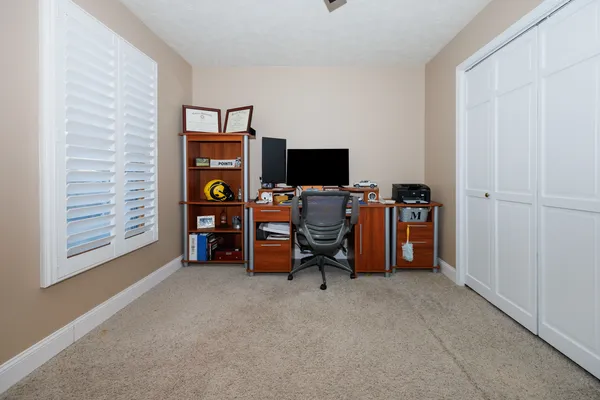 a view of a livingroom with workspace